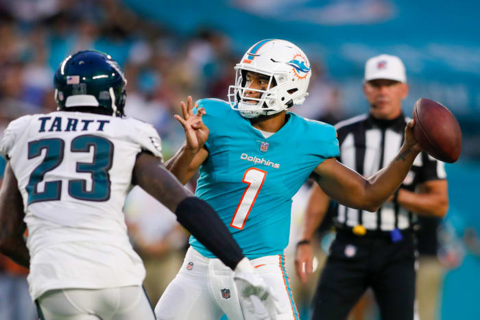 Miami Dolphins quarterback Tua Tagovailoa (1) passes the football as Philadelphia Eagles safety Jaquiski Tartt (23) defends during the first quarter at Hard Rock Stadium.